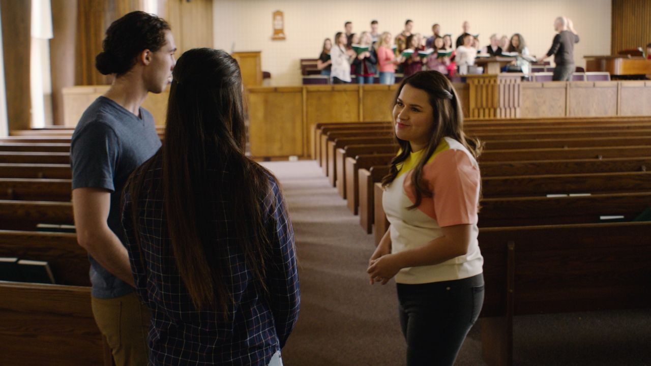 A couple is taken on a tour of a church building